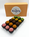 A sweet decision for an anniversary gift, a box of Anniversary Fruits Brigadeiros in a plastic container.