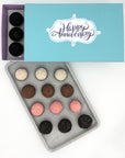 A box of Anniversary Classic Brigadeiros truffles with the words happy anniversary, available in a variety of flavors.