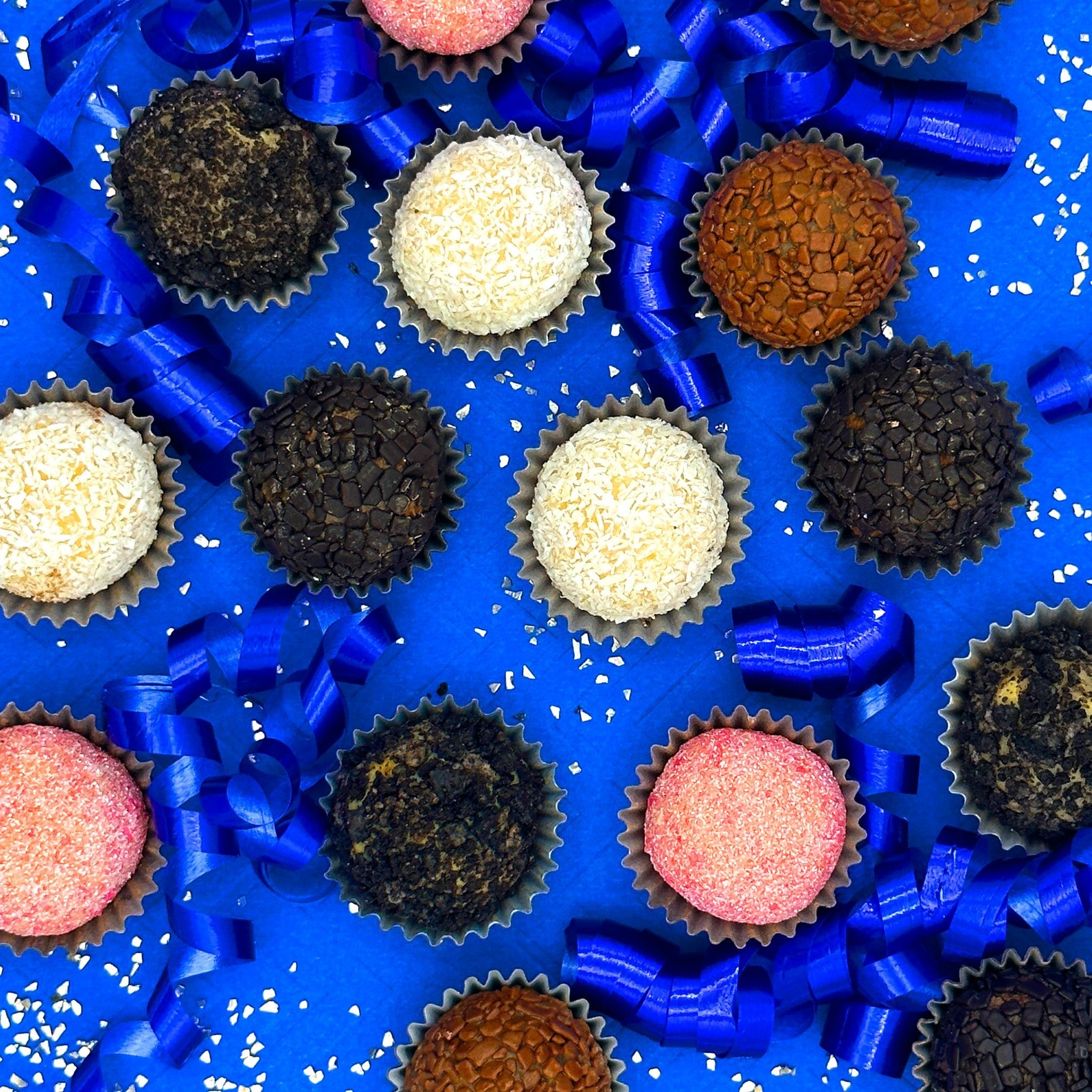 A group of Anniversary Classic Brigadeiros on a blue background for an anniversary celebration.